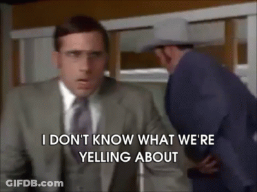 A Man In A Suit And Tie Is Yelling At Another Man GIF
