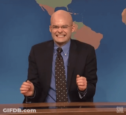 A Man In A Suit And Tie Laughs In Front Of A Snl Map GIF