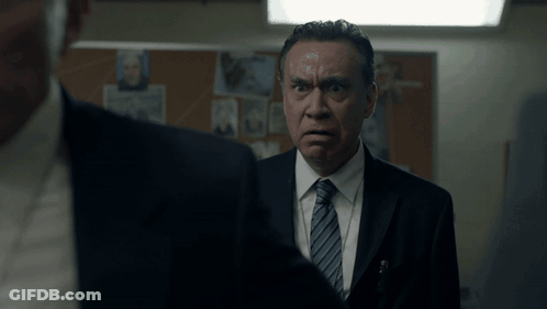Two Men In Suits Talking GIF