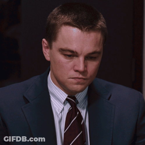 A Man In A Suit And Tie Looks Serious GIF