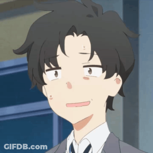 A Man In A Suit And Tie Making A Face GIF