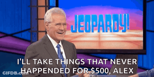 A Man In A Suit And Tie On A Jeopardy Set GIF