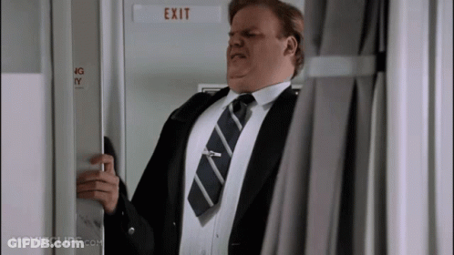 A Man In A Suit And Tie Opens An Exit Door GIF