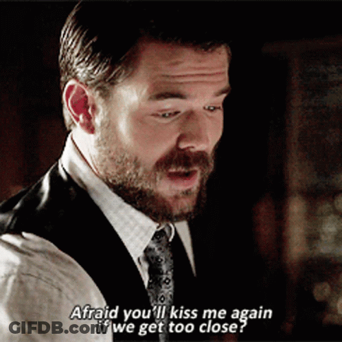 A Man In A Suit And Tie Says " Afraid You Ll Kiss Me Again If We Get Too Close " GIF