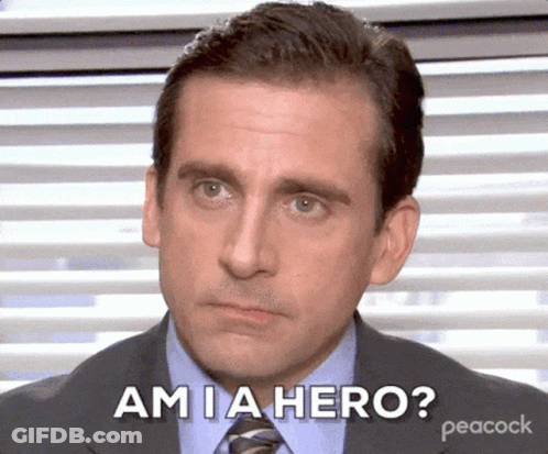 A Man In A Suit And Tie Says Am Ia Hero GIF