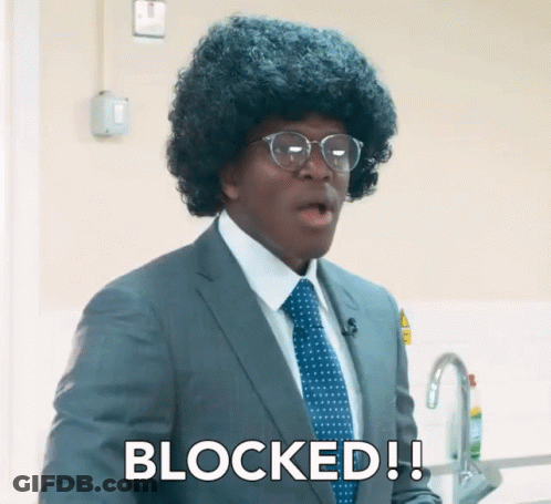 A Man In A Suit And Tie Says Blocked In White Letters GIF