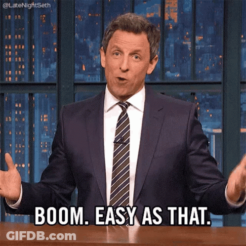 A Man In A Suit And Tie Says Boom Easy As That .. GIF