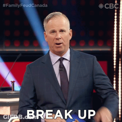 A Man In A Suit And Tie Says Break Up On A Stage GIF