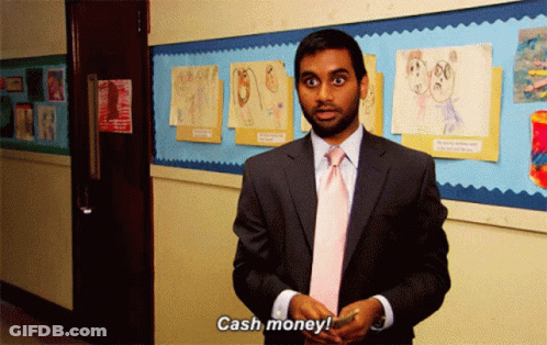 A Man In A Suit And Tie Says Cash Money In A Hallway GIF