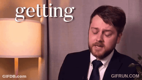A Man In A Suit And Tie Says Getting GIF