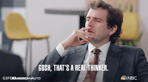 A Man In A Suit And Tie Says " Gosh " That 'S A Real Thinker GIF