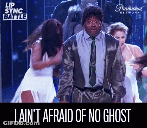 A Man In A Suit And Tie Says I Ain 'T Afraid Of No Ghost While Dancing GIF