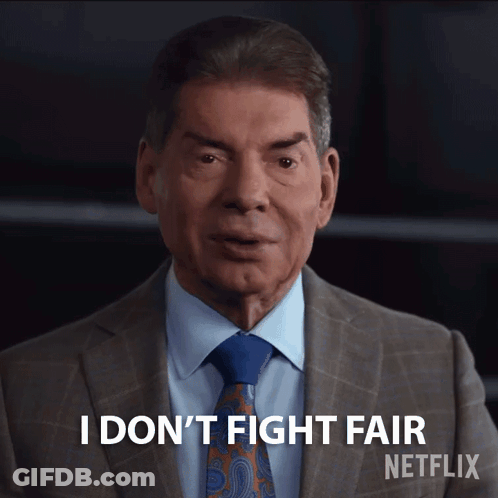 A Man In A Suit And Tie Says I Don T Fight Fair GIF