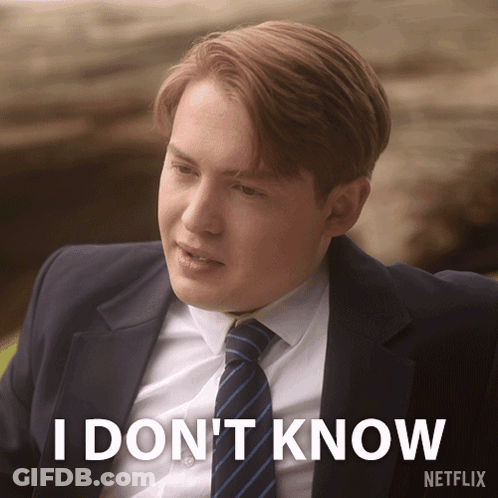 A Man In A Suit And Tie Says I Don T Know GIF