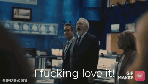 A Man In A Suit And Tie Says " I Fucking Love It " GIF