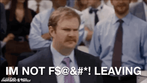 Man In Suit Says Im Not Leaving In Front Of Crowd GIF