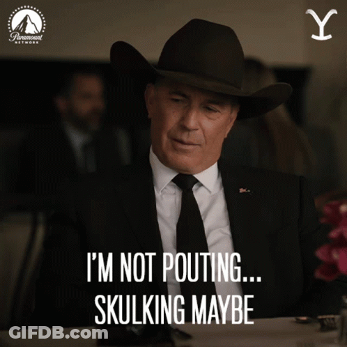 A Man In A Suit And Tie Says I 'M Not Pouting ... Skullking Maybe GIF