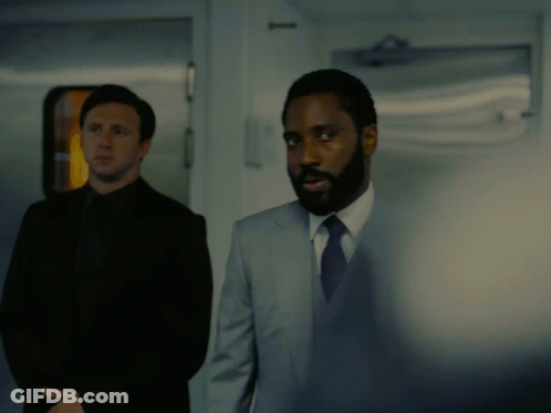 A Man In A Suit And Tie Says " I Ordered My Hot Sauce An Hour Ago " In A Dark Room GIF