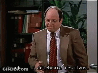 A Man In A Suit And Tie Says I Uh ... I Celebrate Festivus GIF