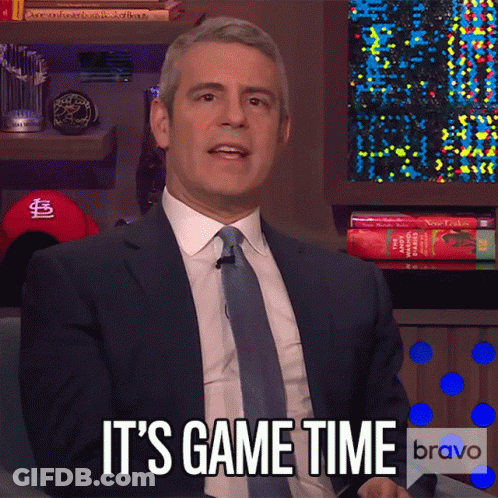 A Man In A Suit And Tie Says It 'S Game Time On Bravo GIF