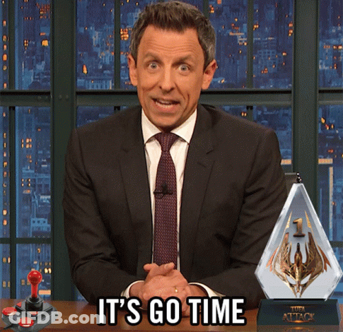 A Man In A Suit And Tie Says It 'S Go Time In Front Of A Video Game Controller GIF