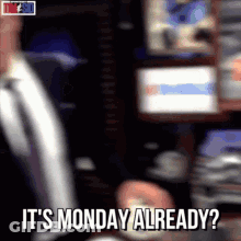 A Man In A Suit And Tie Says It 'S Monday Already . GIF