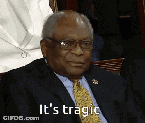 A Man In A Suit And Tie Says It 'S Tragic While Sitting In A Chair GIF