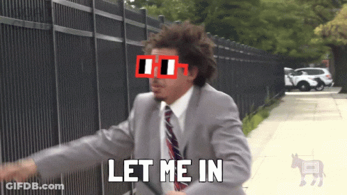 A Man In A Suit And Tie Says Let Me In In Front Of A Fence GIF