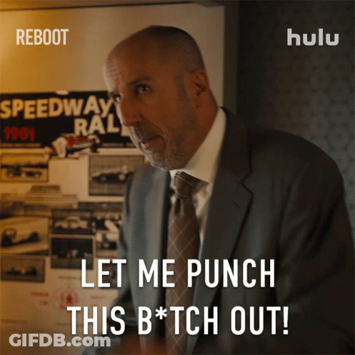 A Man In A Suit And Tie Says " Let Me Punch This Bitch Out " GIF