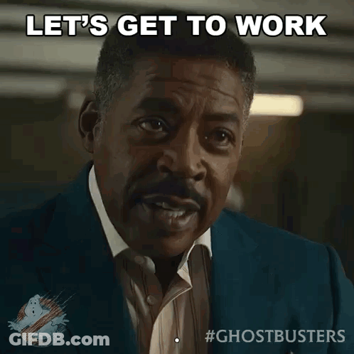 A Man In A Suit And Tie Says " Let 'S Get To Work " GIF