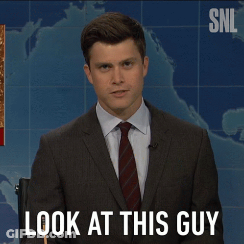 A Man In A Suit And Tie Says Look At This Guy In Front Of A Map GIF