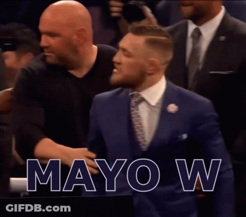 A Man In A Suit And Tie Says Mayo W On The Screen GIF