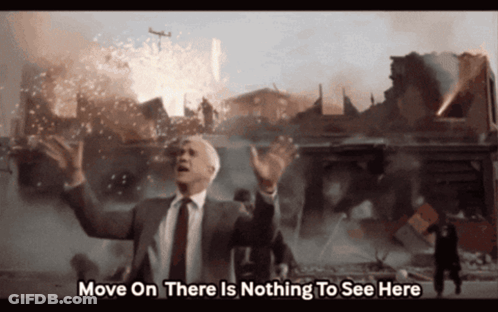 A Man In A Suit And Tie Says " Move On There Is Nothing To See Here " In Front Of A Destroyed City GIF