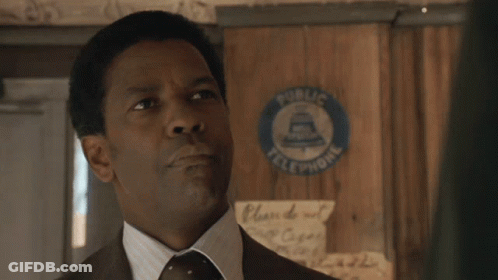 A Man In A Suit And Tie Says " My Man " In Front Of A Public Telephone Sign GIF