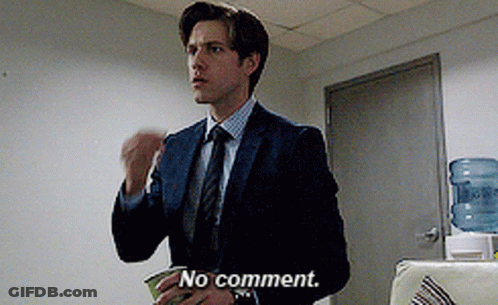 A Man In A Suit And Tie Says " No Comment " In Front Of A Water Cooler GIF