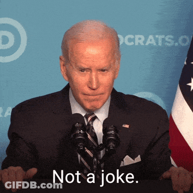 A Man In A Suit And Tie Says " Not A Joke " In Front Of A Flag GIF