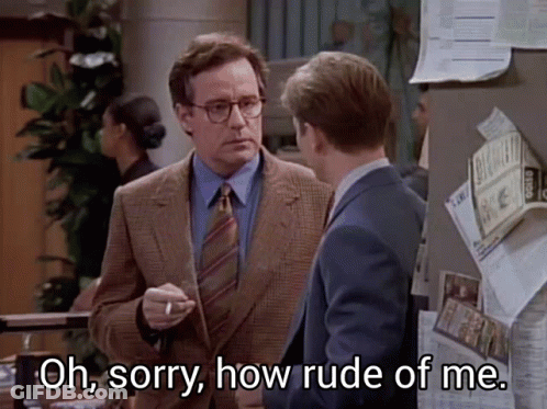 A Man In A Suit And Tie Says Oh Sorry How Rude Of Me While Smoking A Cigarette GIF