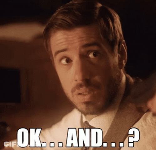 A Man In A Suit And Tie Says " Ok And ? " GIF