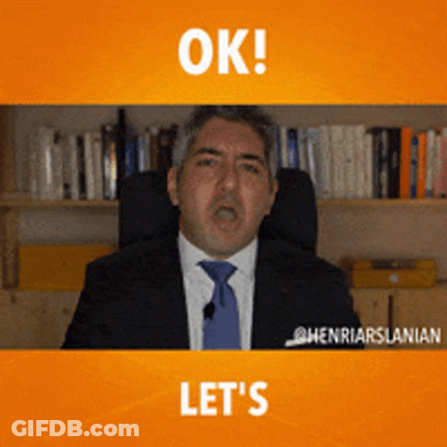 A Man In A Suit And Tie Says " Ok " And " Let 'S " GIF