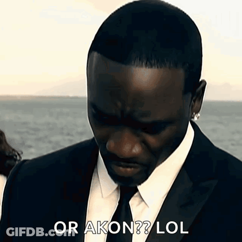 A Man In A Suit And Tie Says Or Akon LOL . GIF