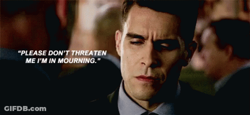 A Man In A Suit And Tie Says " Please Don 'T Threaten Me I 'M In Mourning . " GIF