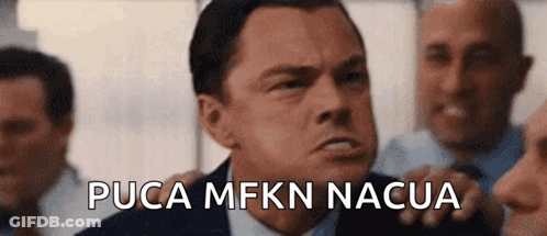 A Man In A Suit And Tie Says Pucca Mfkn Nacua In Front Of Other Men GIF
