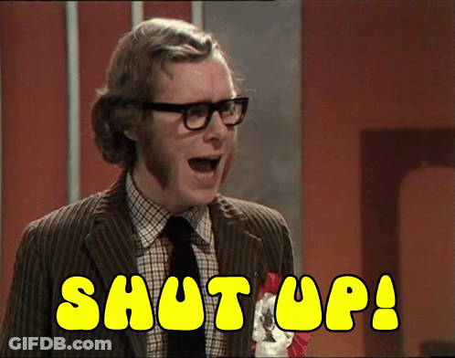 A Man In A Suit And Tie Says Shut Up In Yellow Letters GIF