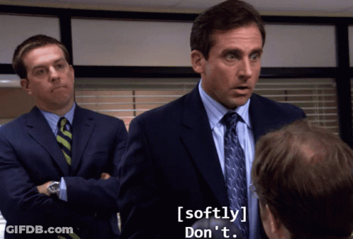 A Man In A Suit And Tie Says Softly Don T GIF
