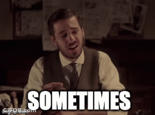 A Man In A Suit And Tie Says Sometimes In Front Of A Desk GIF