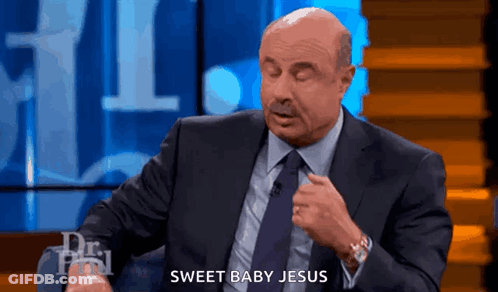 A Man In A Suit And Tie Says Sweet Baby Jesus On A Show GIF