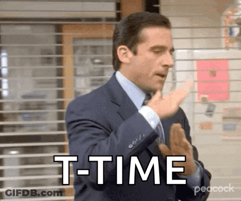 Man In Suit Saying T-Time In Front Of Window GIF