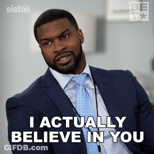 A Man In A Suit And Tie Says That He Actually Believes In You GIF