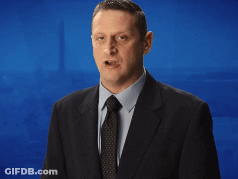 A Man In A Suit And Tie Says That He Has No Problem Being On His Phone GIF
