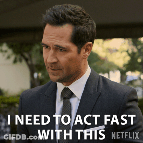 A Man In A Suit And Tie Says That He Needs To Act Fast With This Netflix GIF